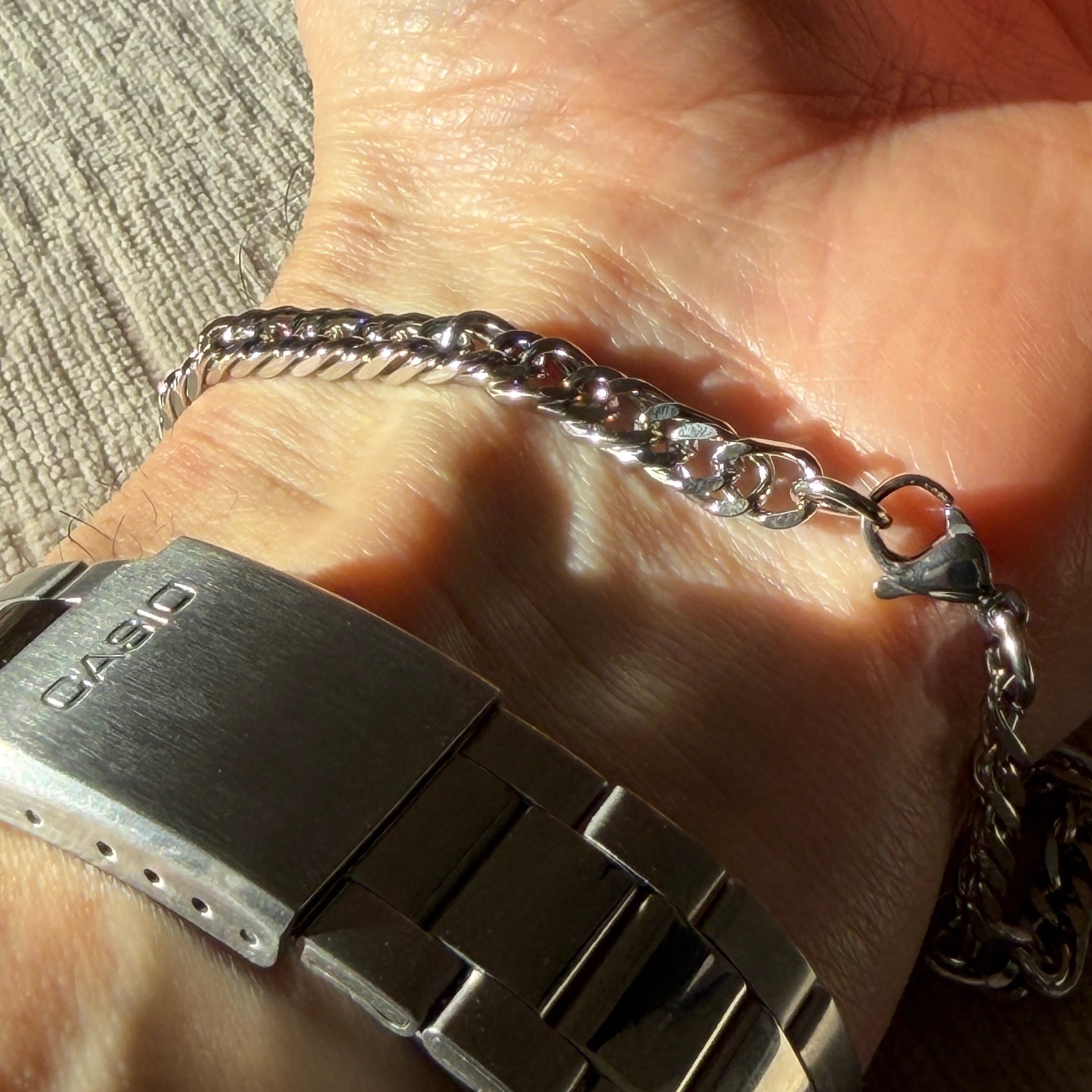 silver chain link bracelet on wrist
