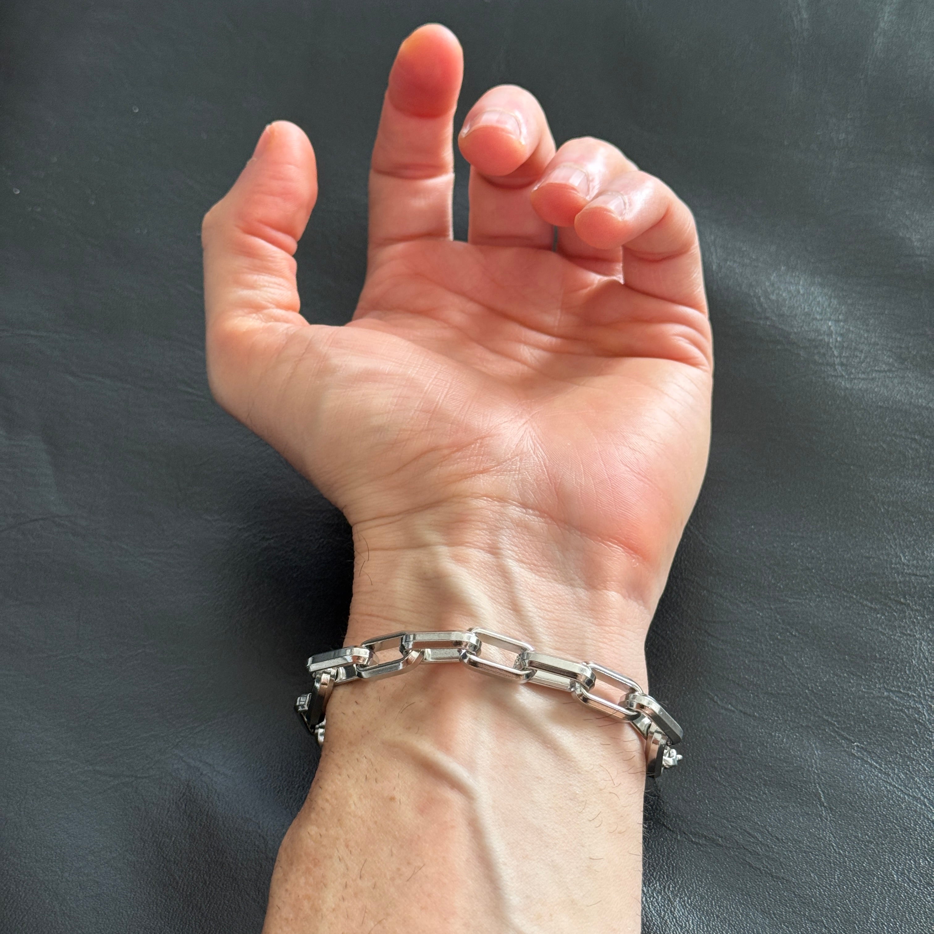 steel bracelet on man's wrist
