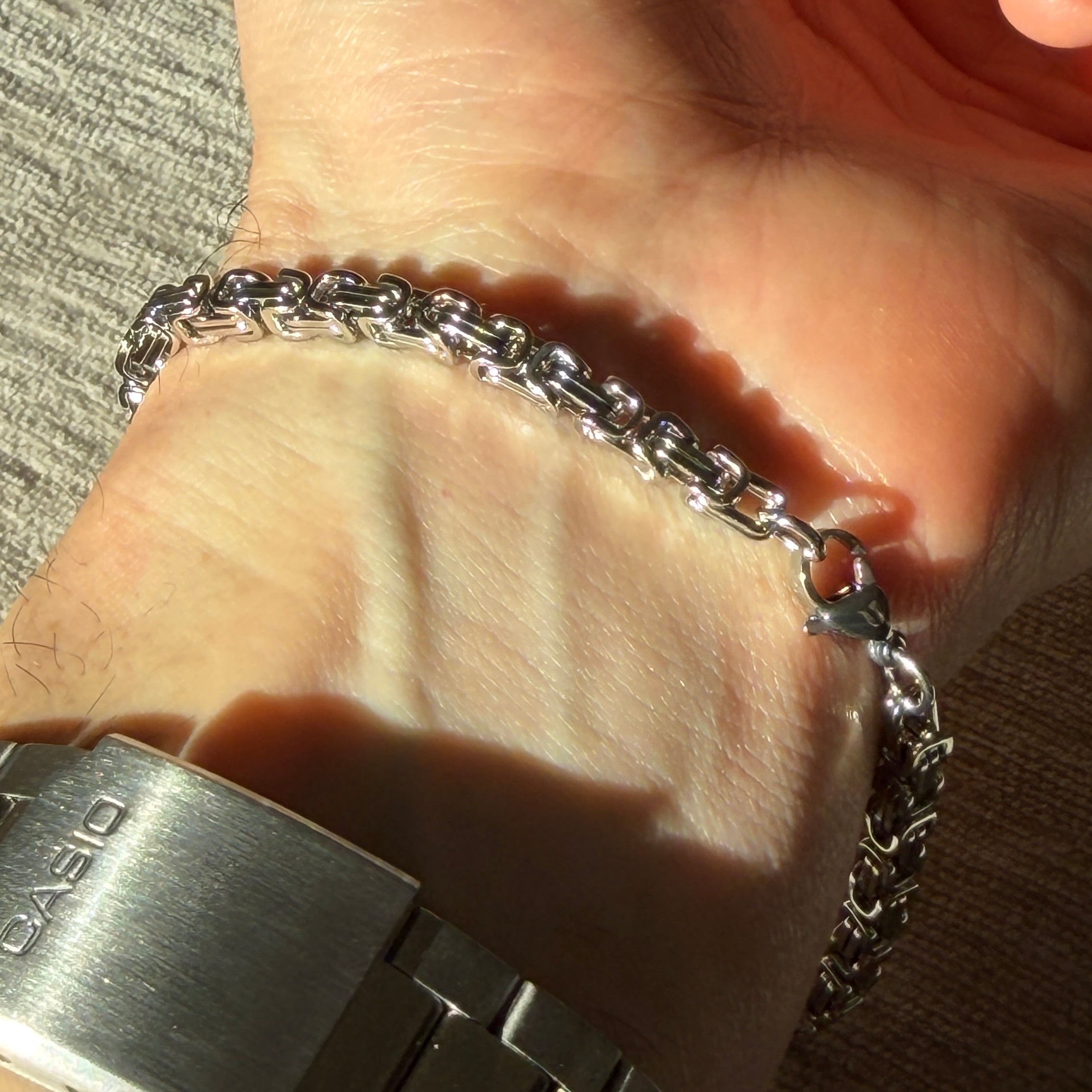 silver bracelet on man's wrist